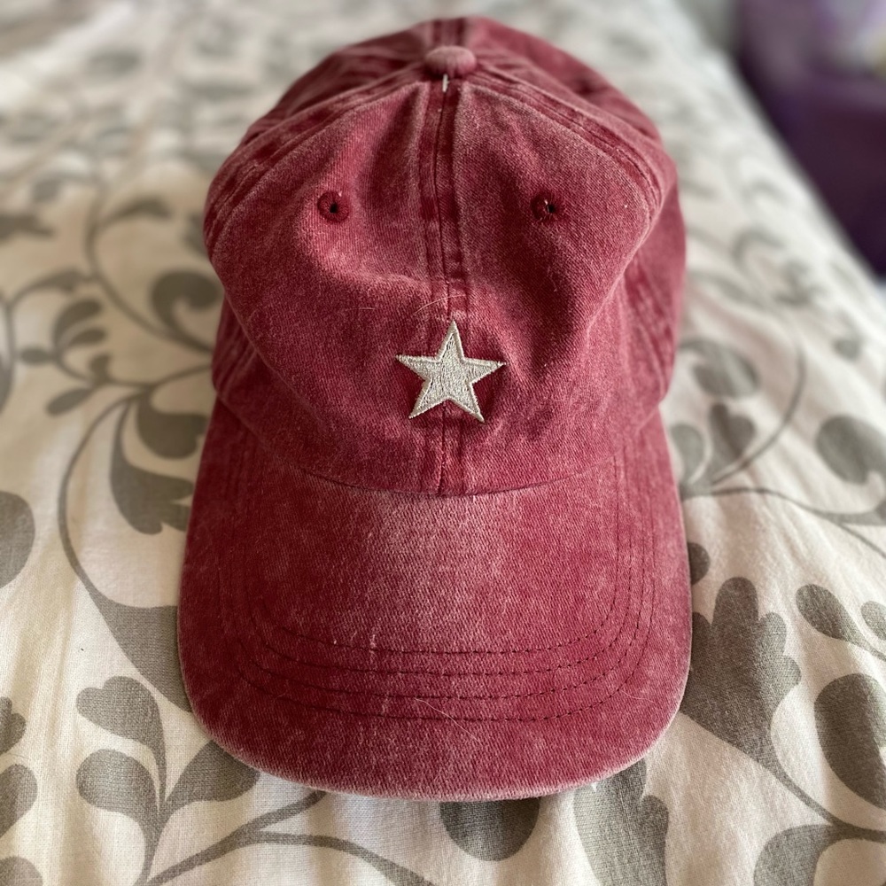 lightly worn maroon baseball cap